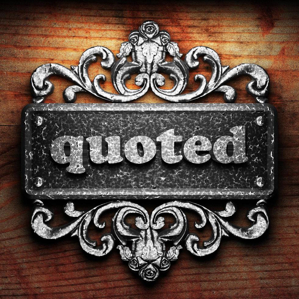 quoted word of iron on wooden background photo