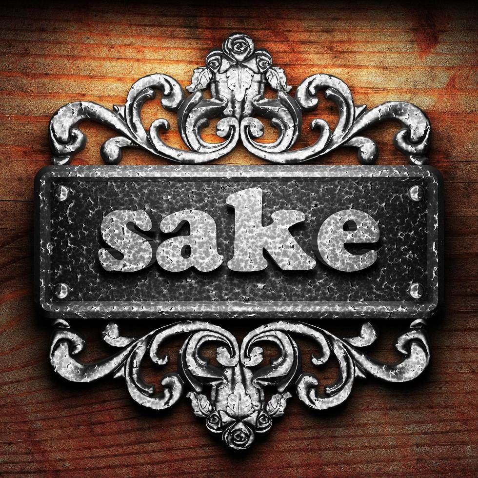 sake word of iron on wooden background photo