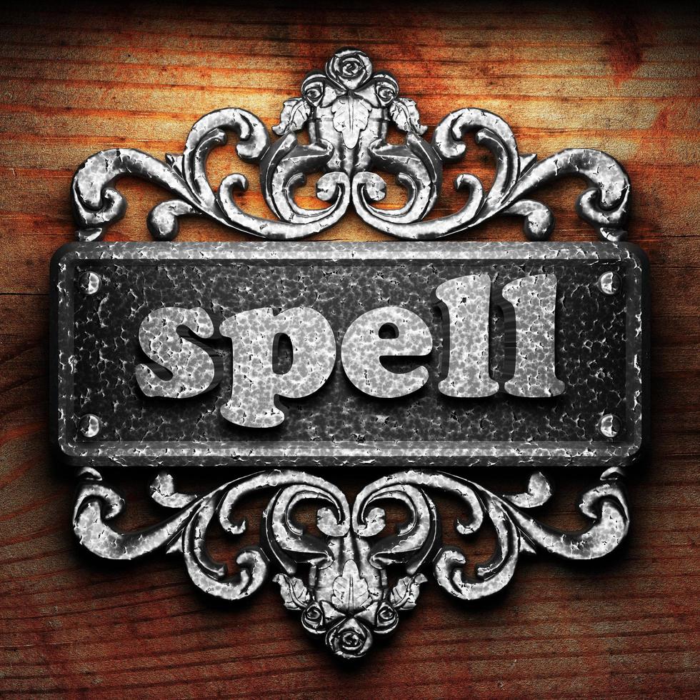 spell word of iron on wooden background photo