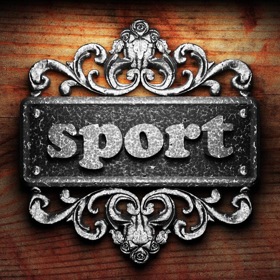 sport word of iron on wooden background photo