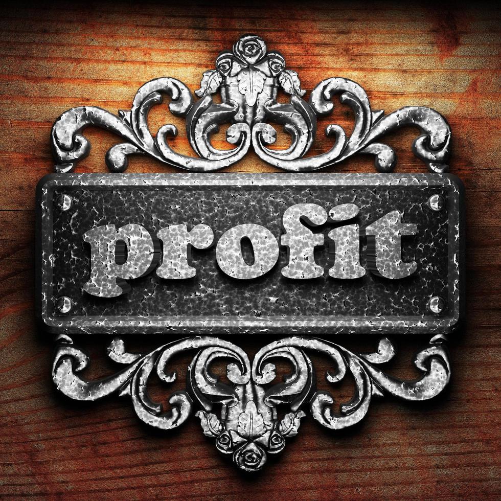 profit word of iron on wooden background photo