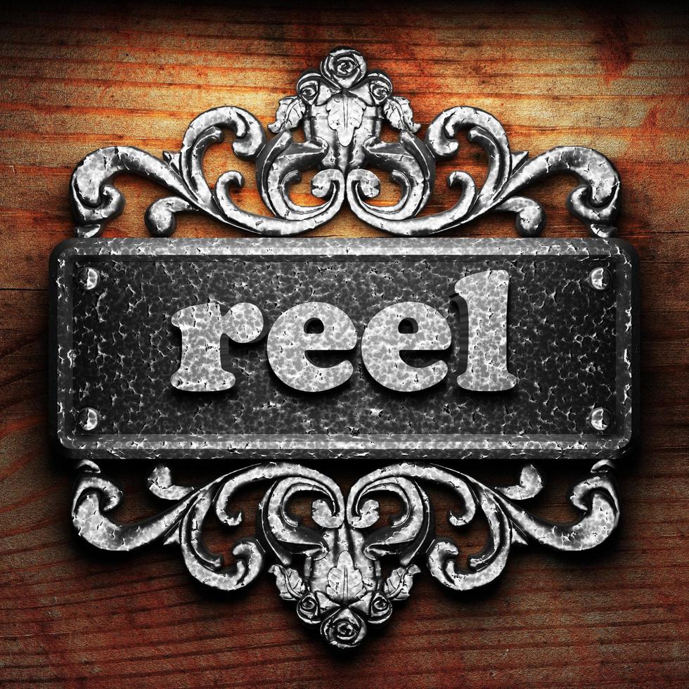 reel word of iron on wooden background photo