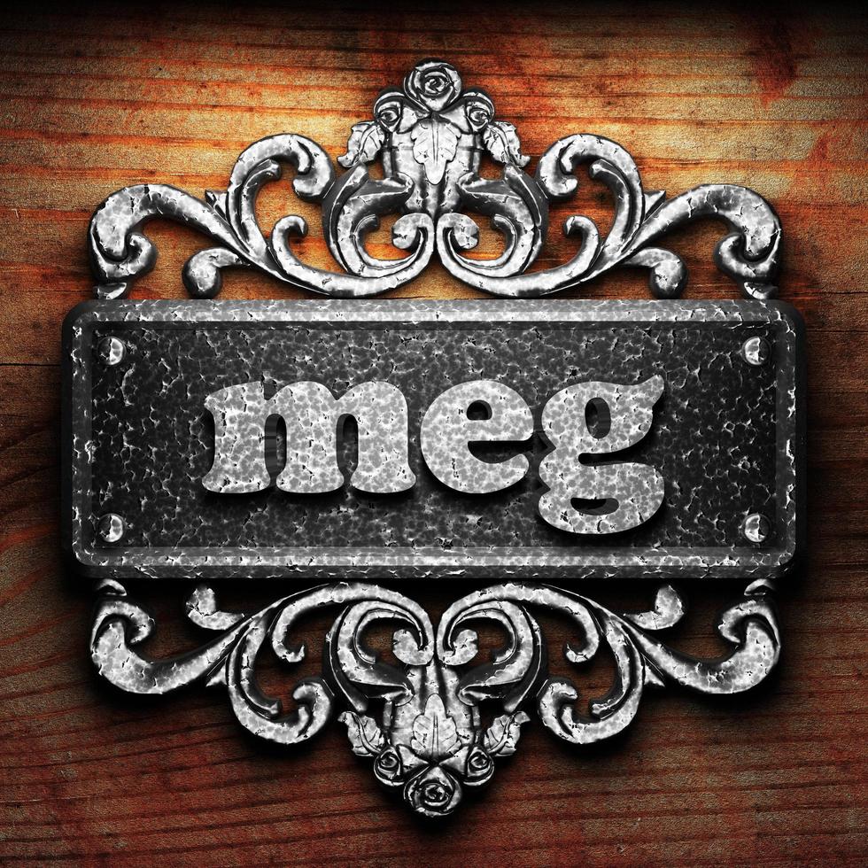 meg word of iron on wooden background photo