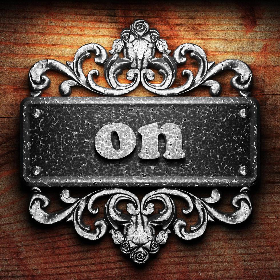 on word of iron on wooden background photo