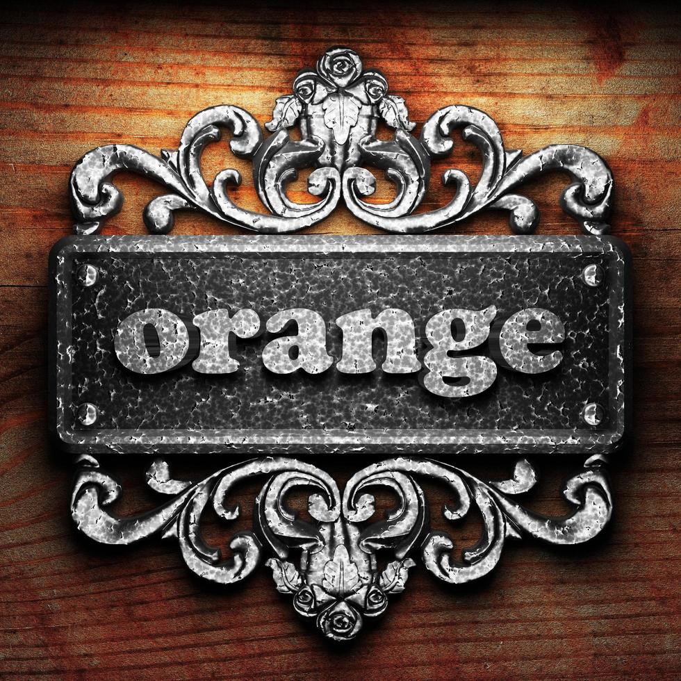 orange word of iron on wooden background photo