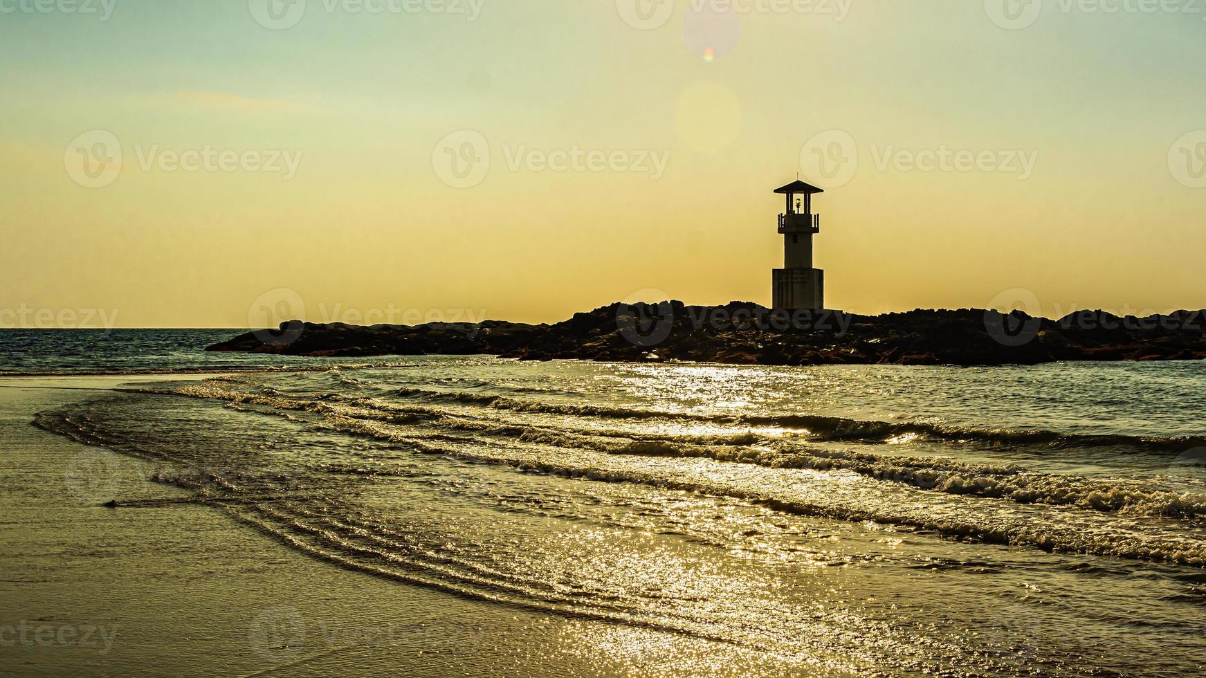 Khao Lak Light Beacon, beautiful sunset time at Nang Thong Beach , Khao Lak, Thailand. Tropical colorful sunset with cloudy sky . Patterns Texture of sand on the beach, Andaman sea Phang nga Thailand photo