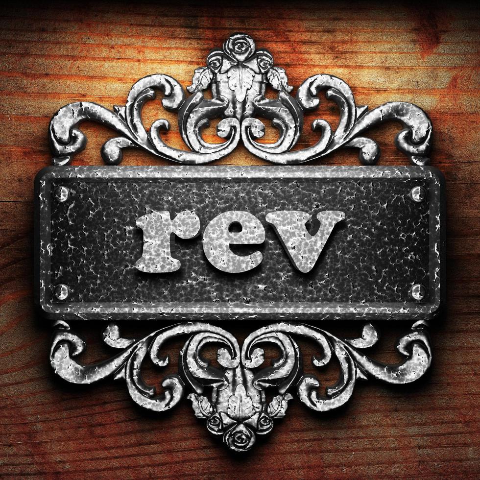 rev word of iron on wooden background photo