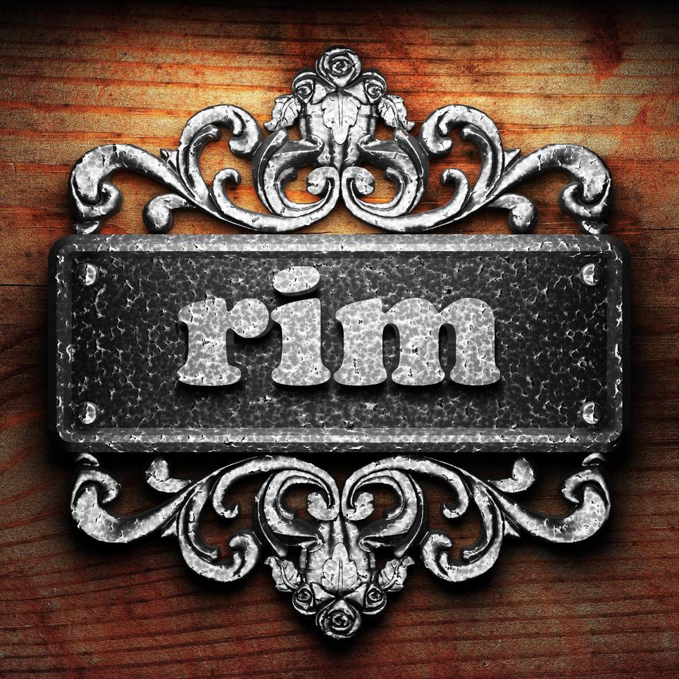 rim word of iron on wooden background photo