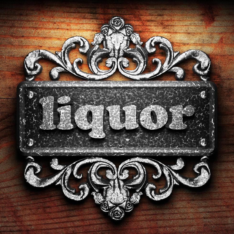 liquor word of iron on wooden background photo