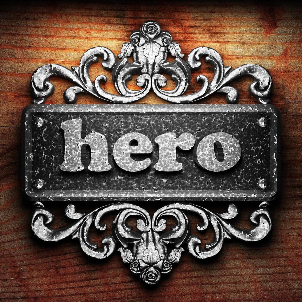 hero word of iron on wooden background photo