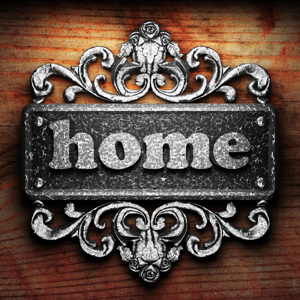 home word of iron on wooden background photo