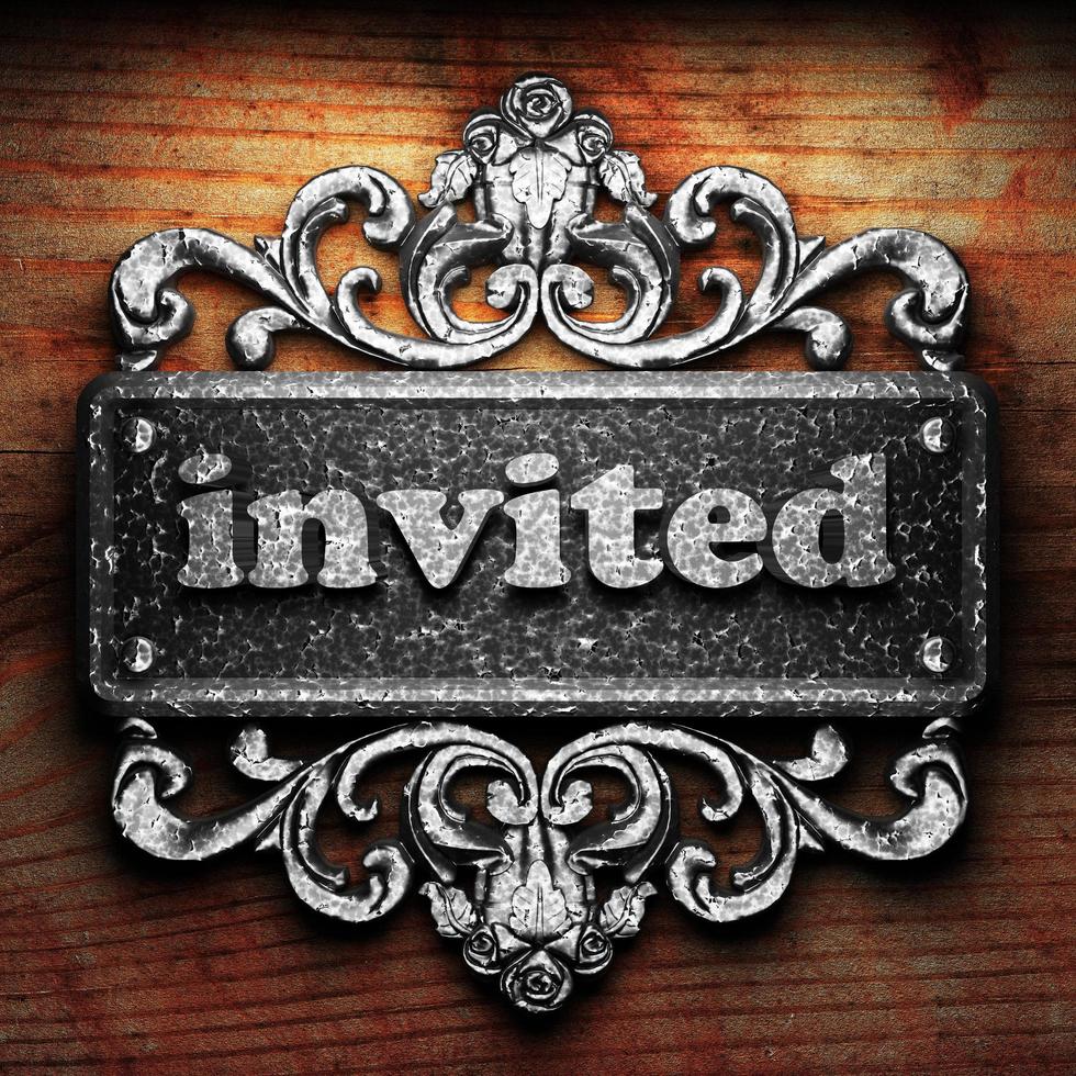 invited word of iron on wooden background photo