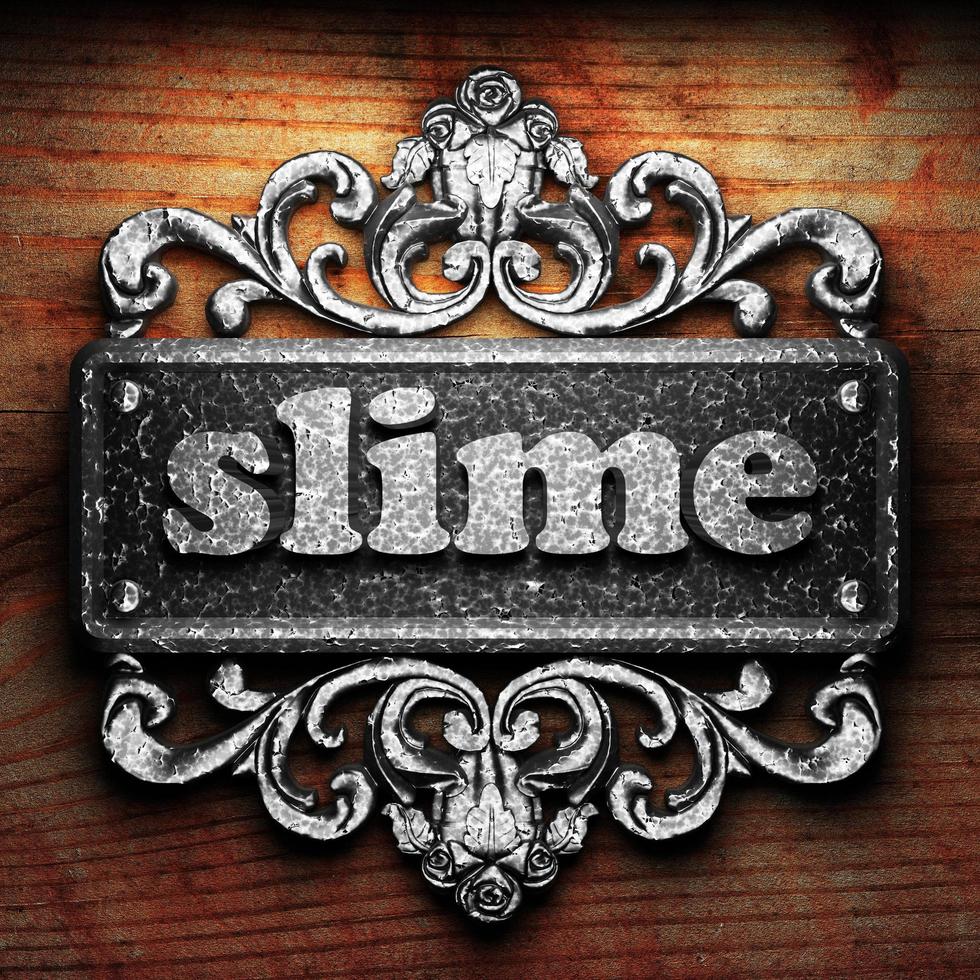 slime word of iron on wooden background photo