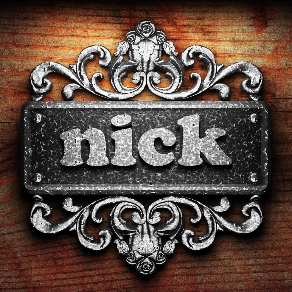 nick word of iron on wooden background photo