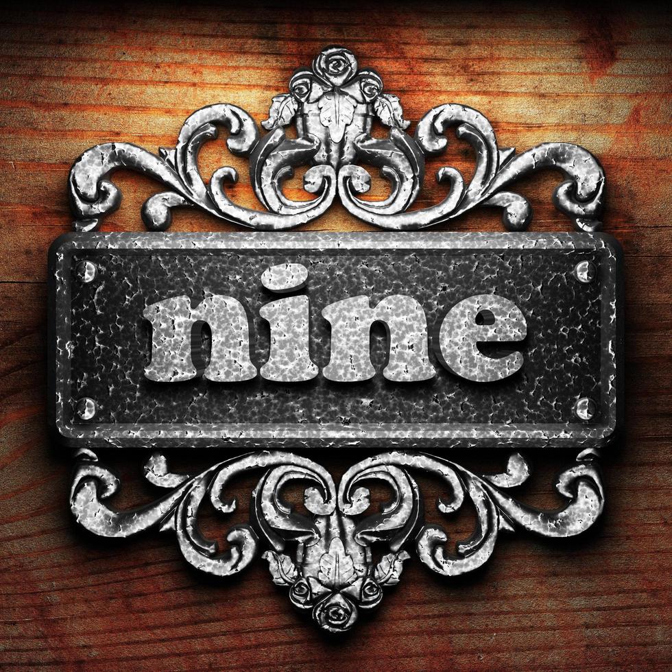 nine word of iron on wooden background photo