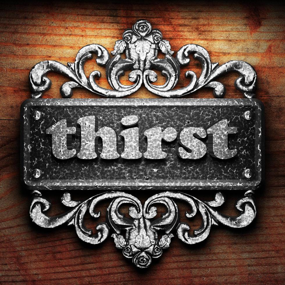 thirst word of iron on wooden background photo