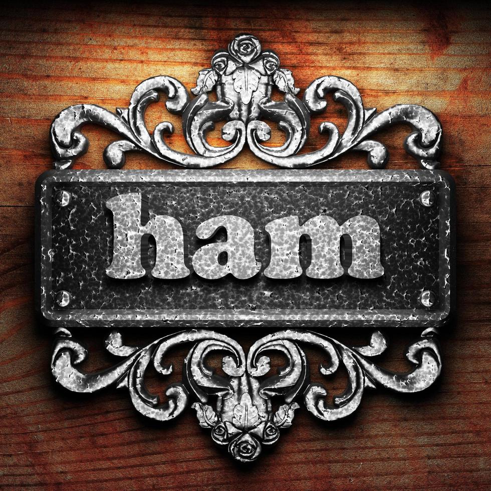 ham word of iron on wooden background photo