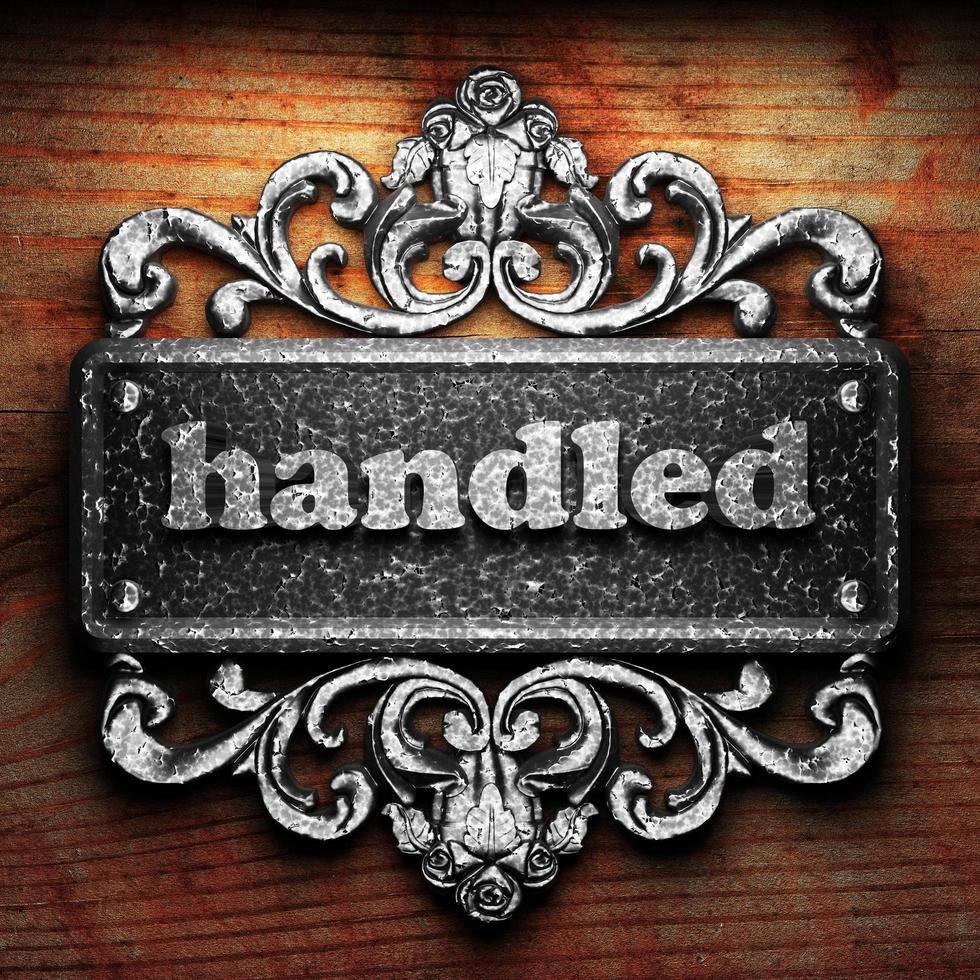 handled word of iron on wooden background photo