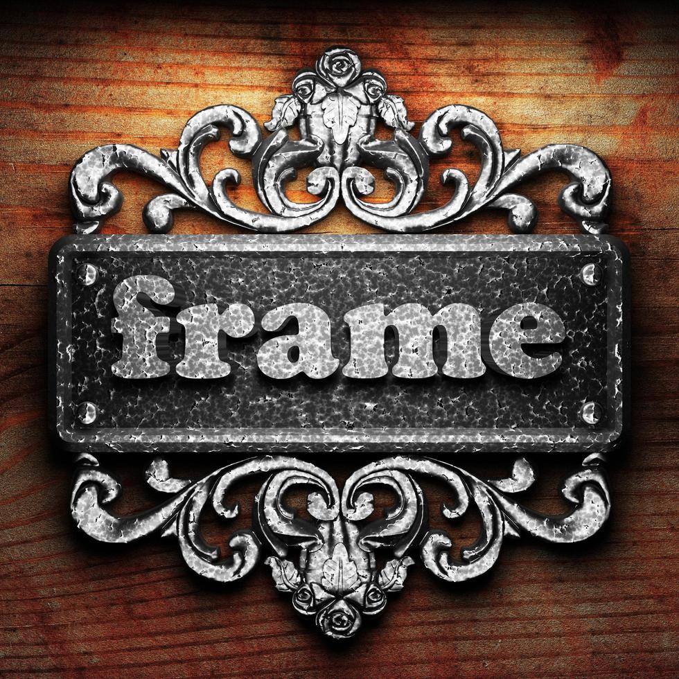 frame word of iron on wooden background photo