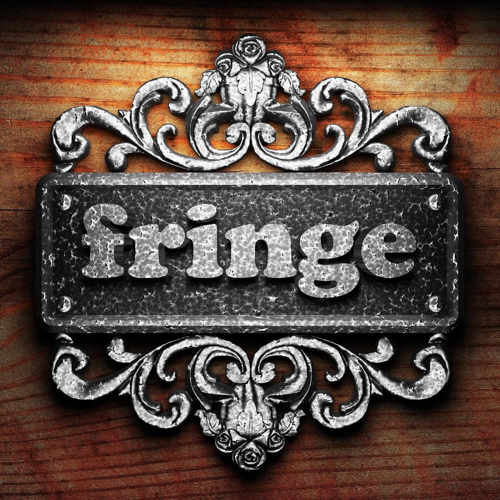 fringe word of iron on wooden background photo