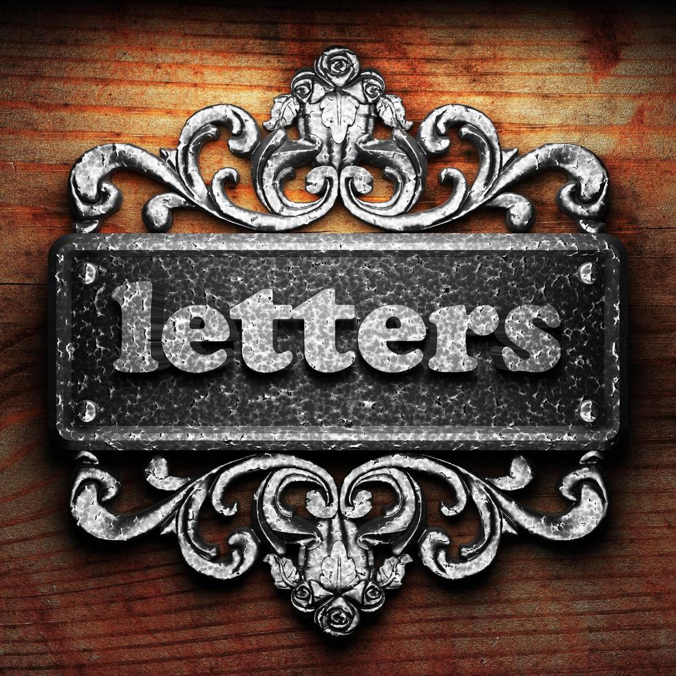 letters word of iron on wooden background photo