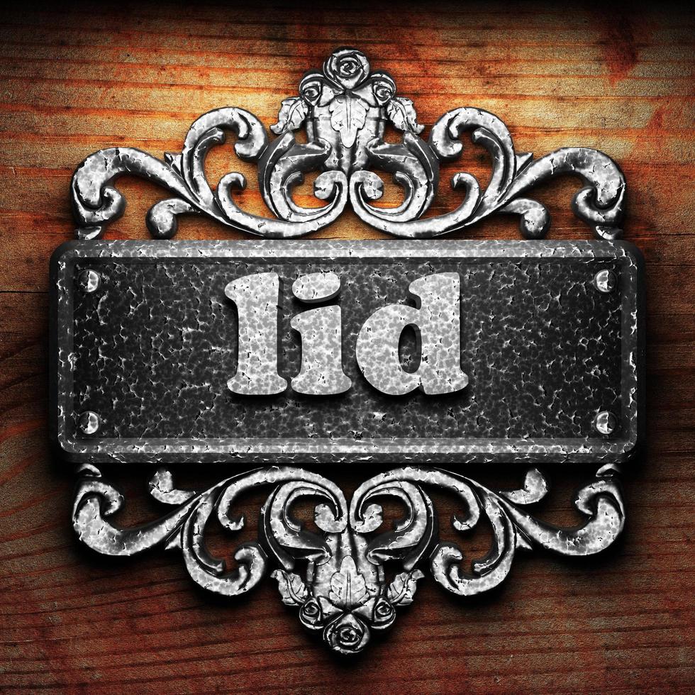lid word of iron on wooden background photo