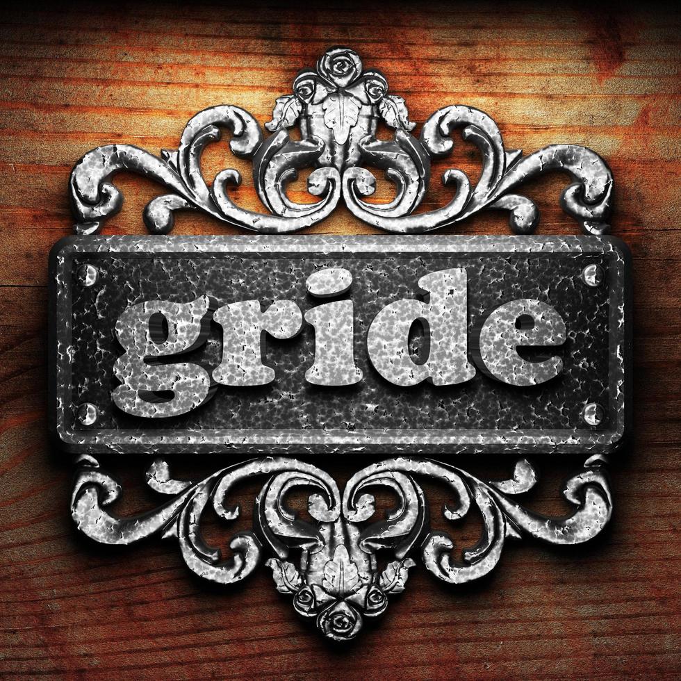 gride word of iron on wooden background photo