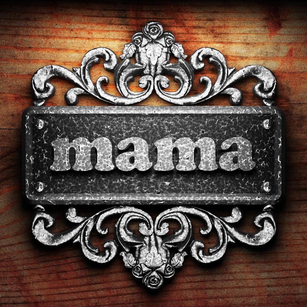 mama word of iron on wooden background photo