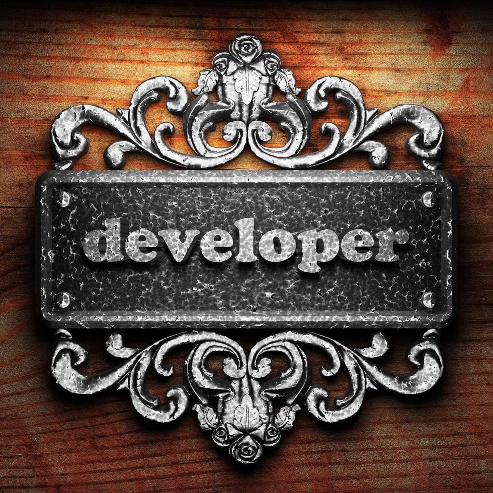 developer word of iron on wooden background photo