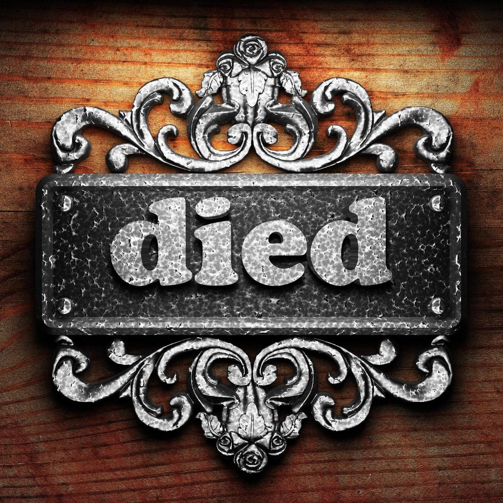 died word of iron on wooden background photo