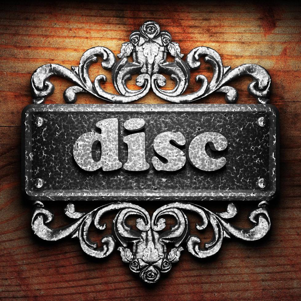 disc word of iron on wooden background photo