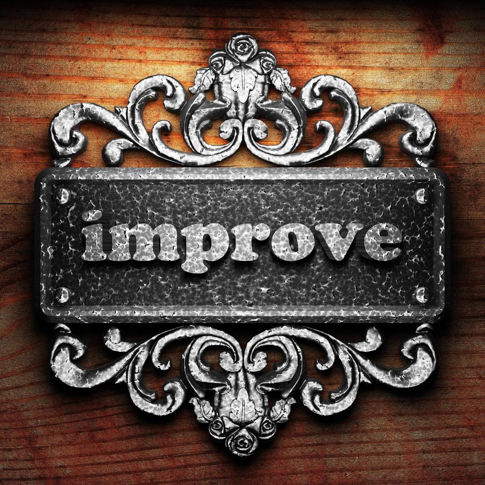 improve word of iron on wooden background photo