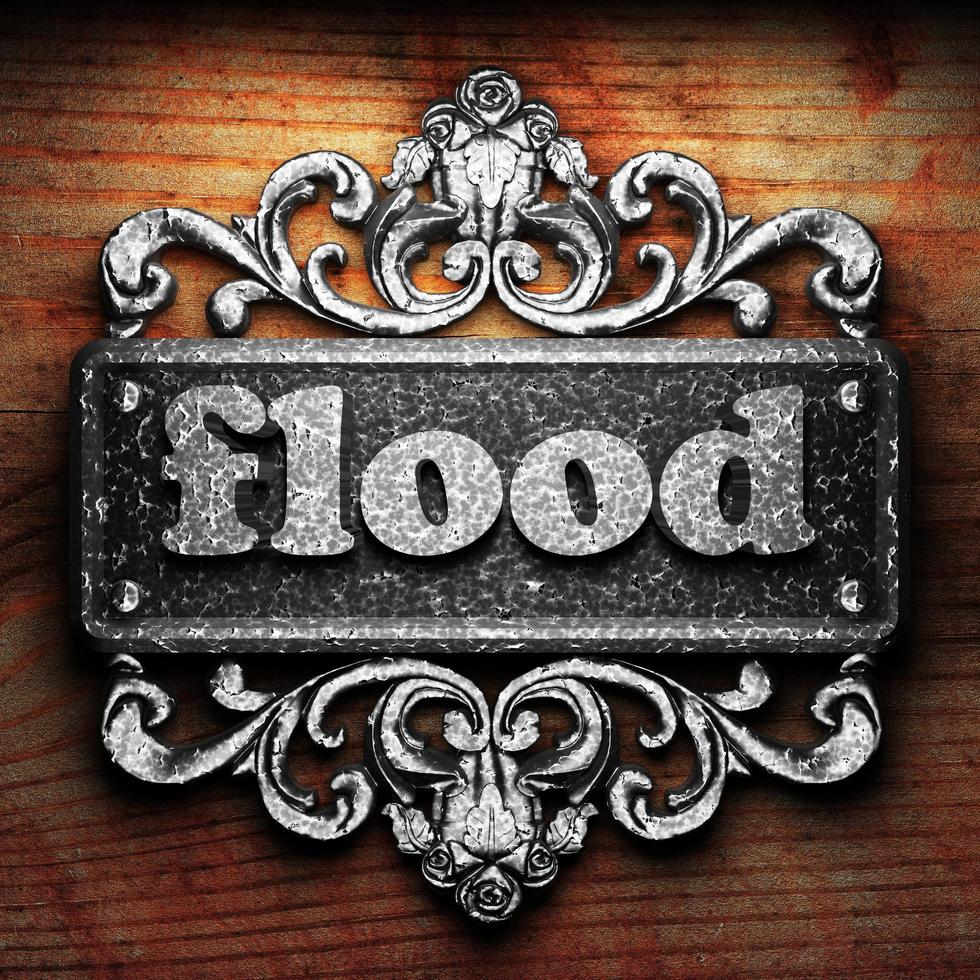 flood word of iron on wooden background photo