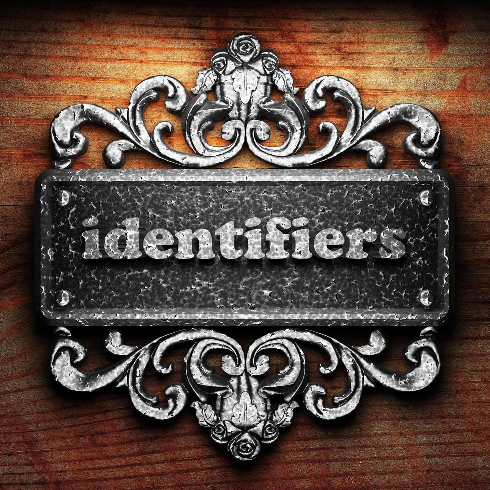 identifiers word of iron on wooden background photo