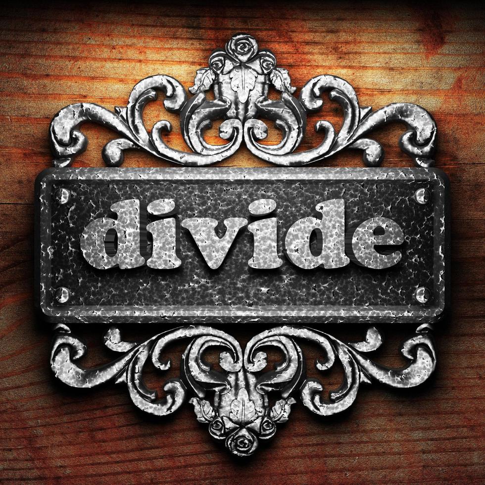 divide word of iron on wooden background photo