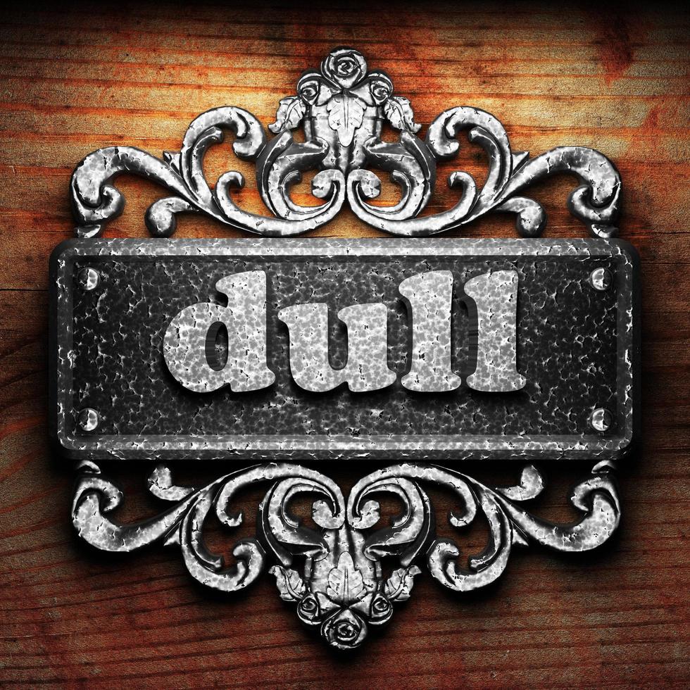 dull word of iron on wooden background photo