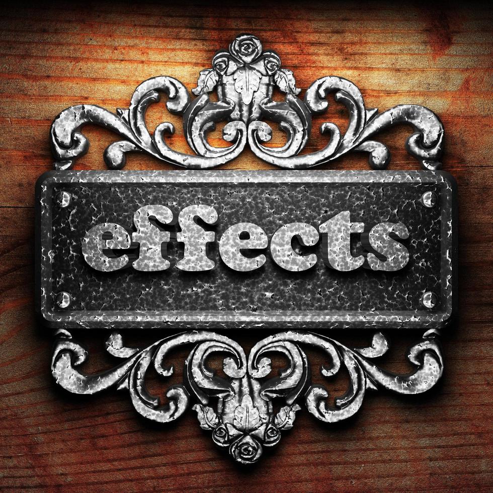 effects word of iron on wooden background photo