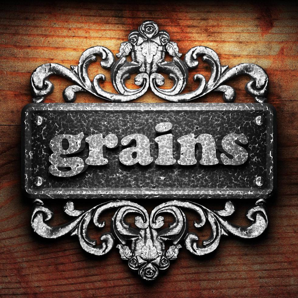 grains word of iron on wooden background photo