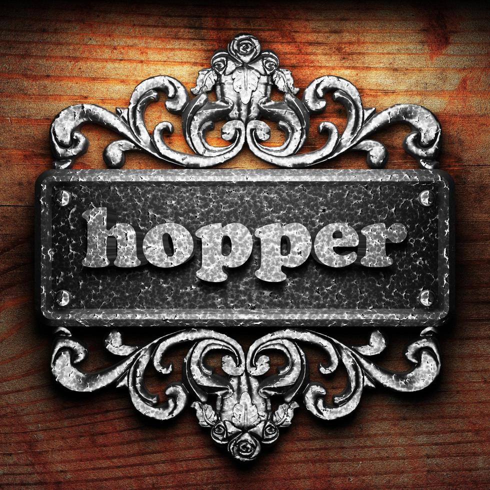 hopper word of iron on wooden background photo