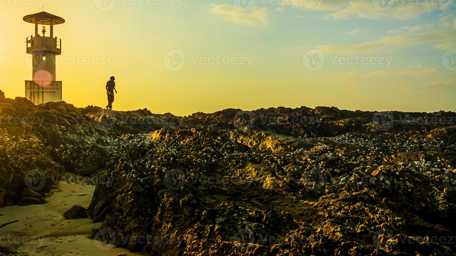 Khao Lak Light Beacon, beautiful sunset time at Nang Thong Beach , Khao Lak, Thailand. Tropical colorful sunset with cloudy sky . Patterns Texture of sand on the beach, Andaman sea Phang nga Thailand photo