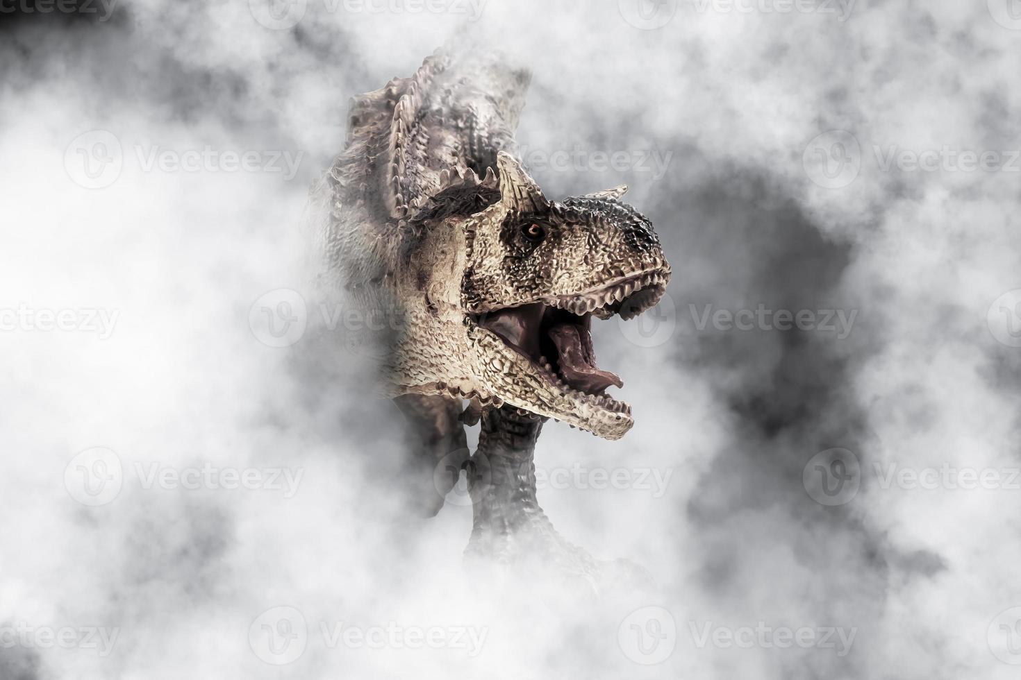 Carnotaurus  Dinosaur on smoke background photo