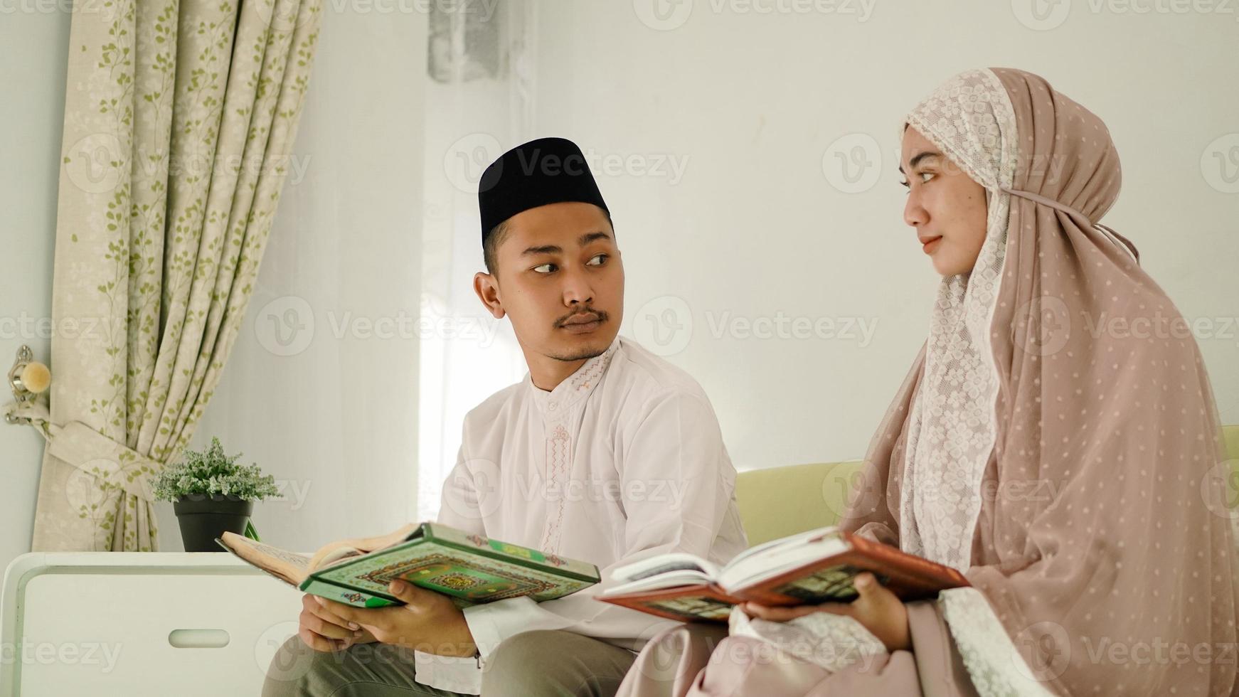 Asian Muslim couple discussing worship photo