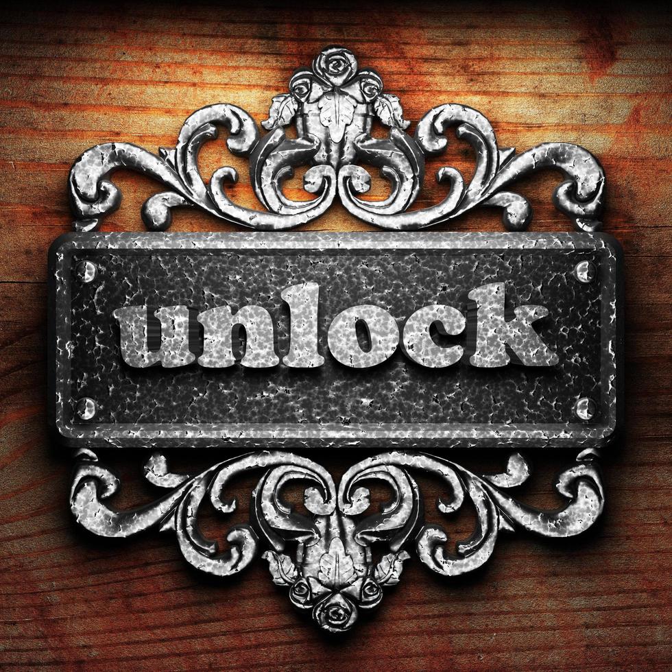 unlock word of iron on wooden background photo