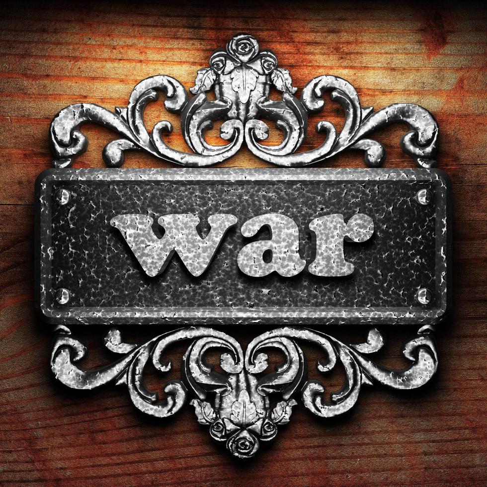 war word of iron on wooden background photo