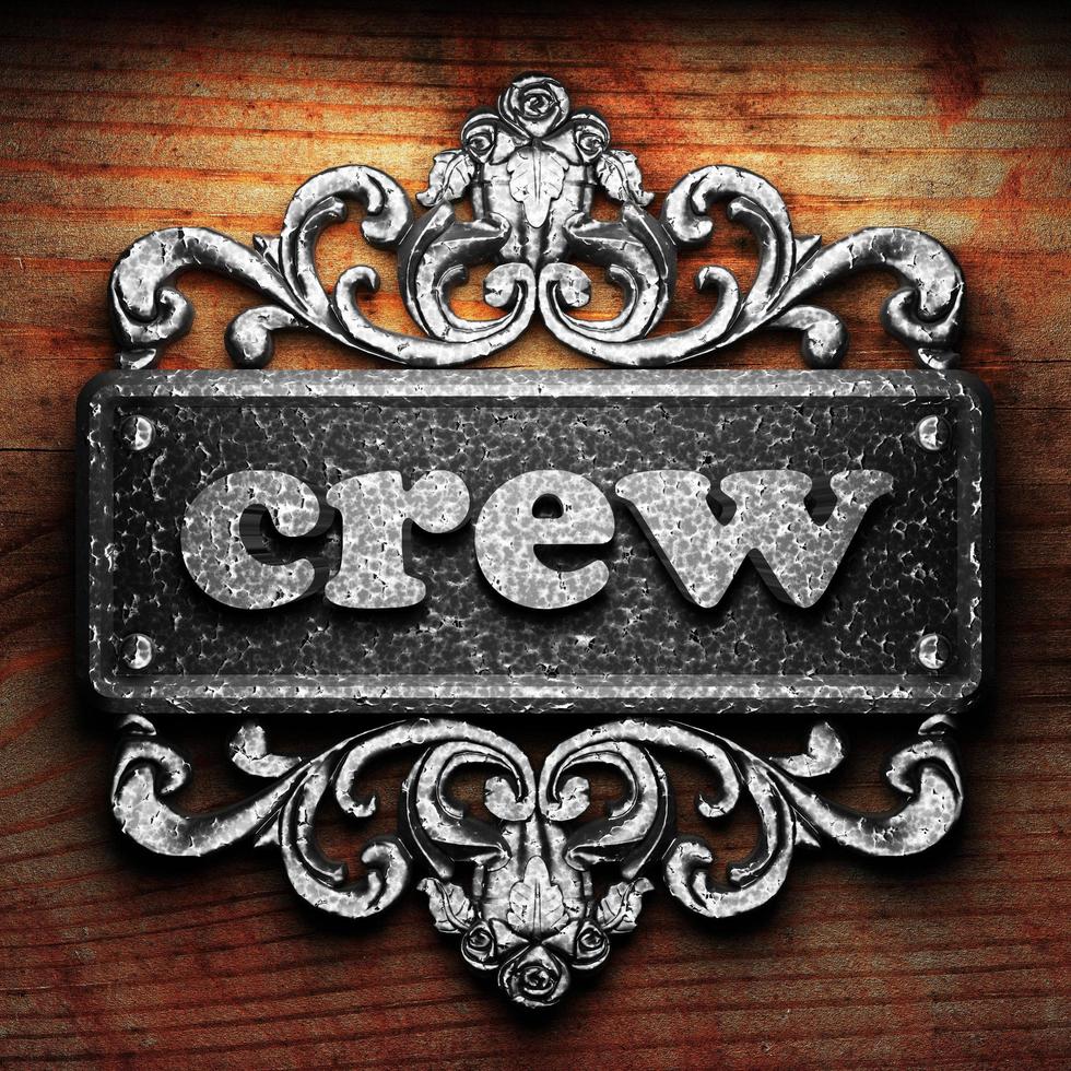 crew word of iron on wooden background photo