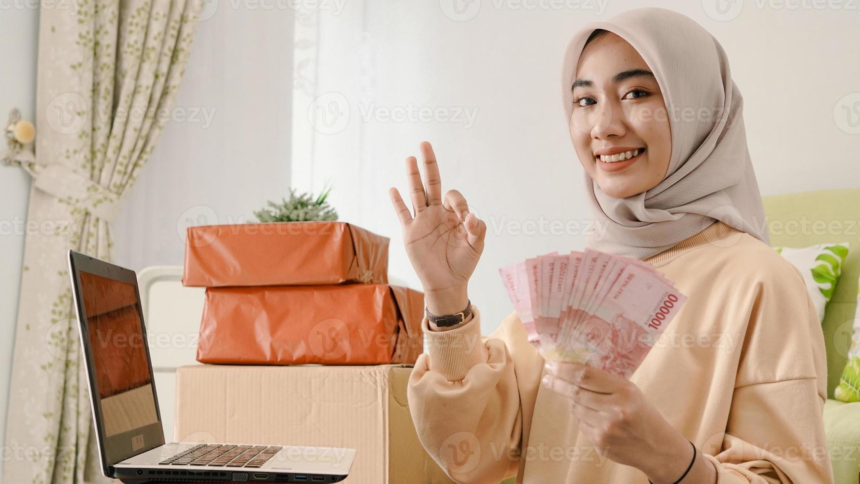beautiful young asian businessman gesturing okay photo