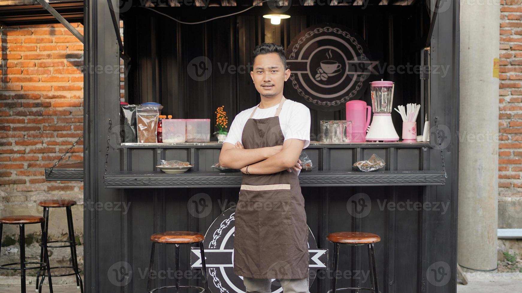 cool asian barista hooded in a container themed shop photo