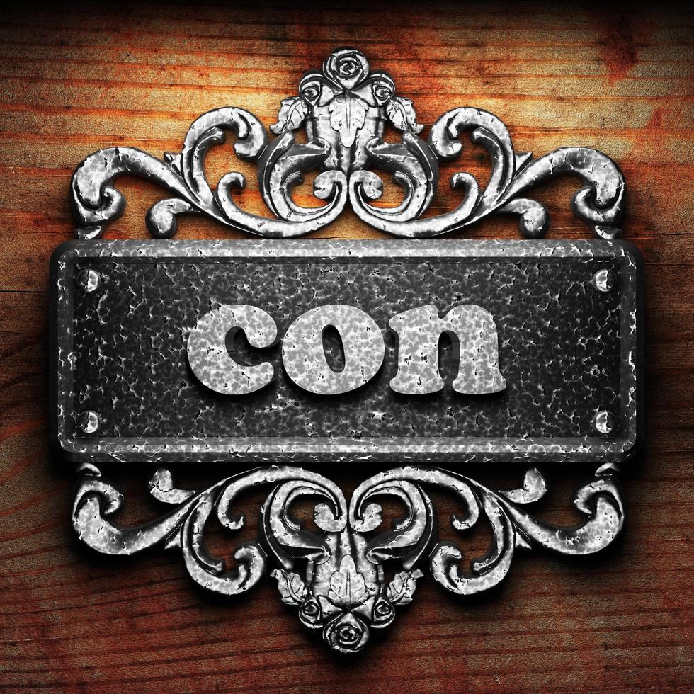 con word of iron on wooden background photo