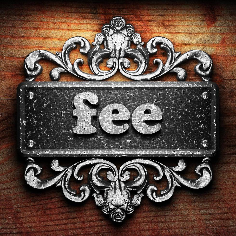 fee word of iron on wooden background photo