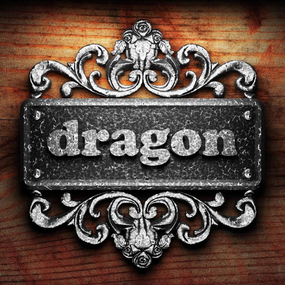 dragon word of iron on wooden background photo